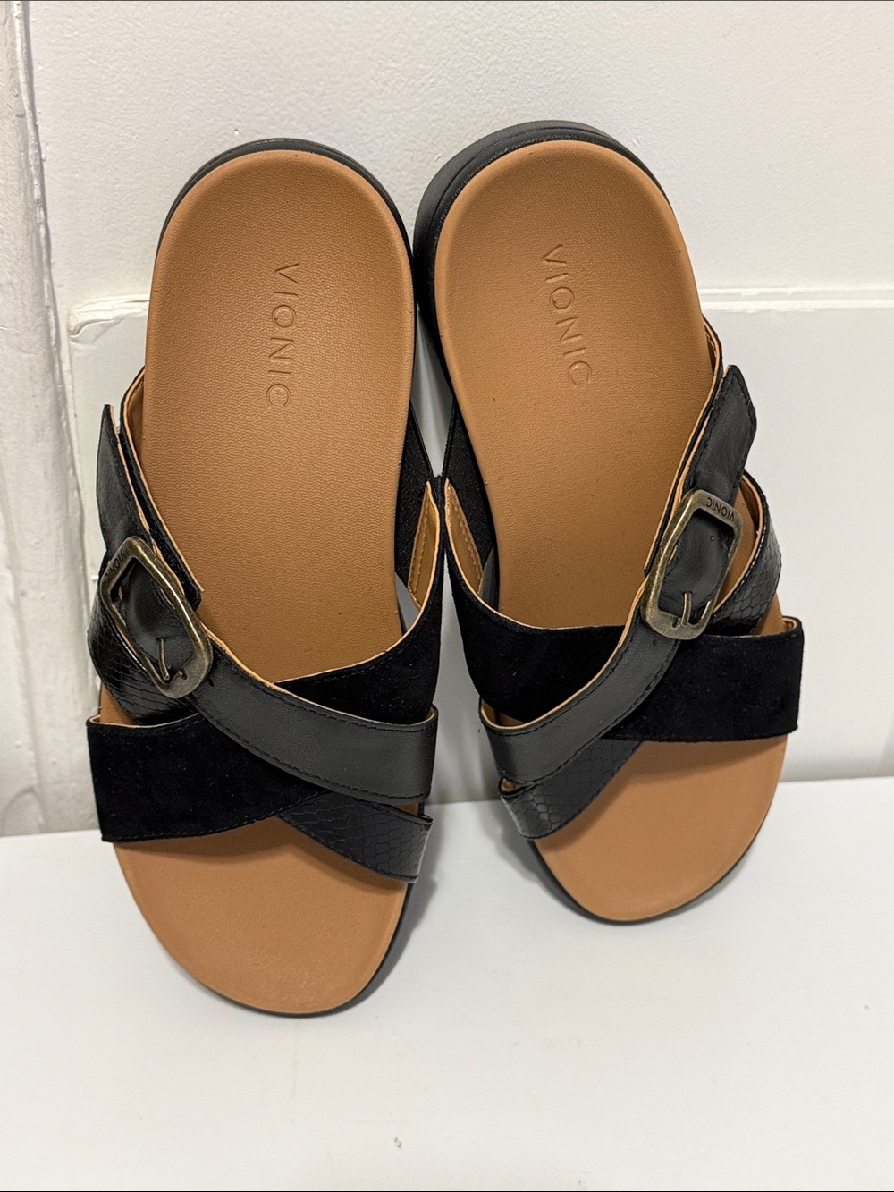 VIONIC Black Crisscross Slide Sandals with Buckle - Brown Footbed .